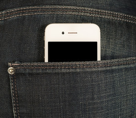 smartphone with a black screen in the pocket of jeans