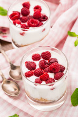 Yogurt with muesli and raspberries