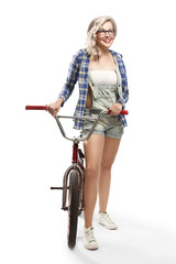 Fototapeta na wymiar Beautiful blonde with a BMX bike