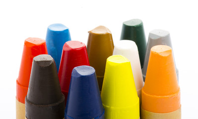 Colour pencils on white background close up