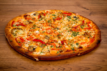 Delicious fresh pizza served on wooden table