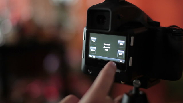 Photographer shooting, photo camera settings