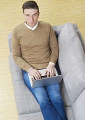 Man on couch with laptop