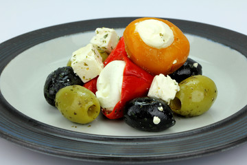 Peppers stuffed with cream cheese with olives.
