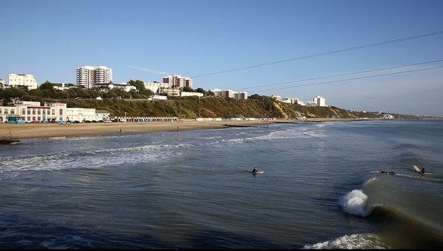 Waves English coast Bournemouth tourist beach surfers