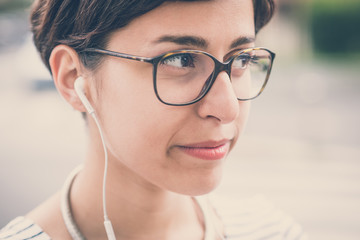 young hipster woman listening to music