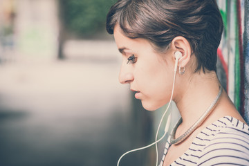young hipster woman listening to music