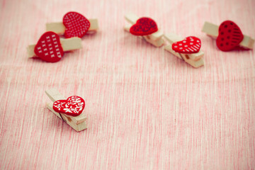 Wooden clothespin heart shaped.