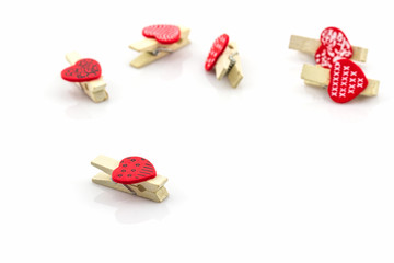 Wooden clothespin heart shaped.