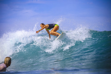 Surfer girl on Amazing Blue Wave