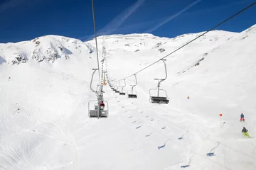 Fotobehang Chair lift at a ski resort St. Anton am Arlberg in winter time © anrymos