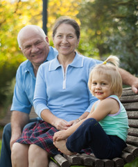 Fototapeta premium grandma and grandpa with little grandaughter