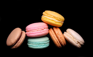 Colorful macaroon over black background