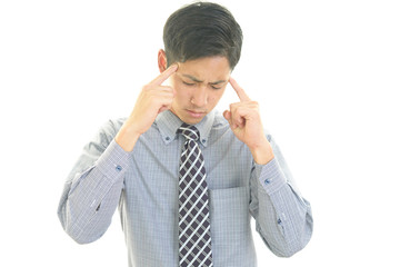 頭痛を訴えるビジネスマン