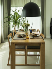 dining table and comfortable chairs in modern home with elegant