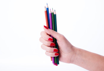 Naklejka premium Woman hand holding pencils