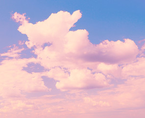 Blue sky background with pink clouds