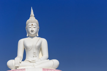 Big white buddha statue and blue sky in Thailand
