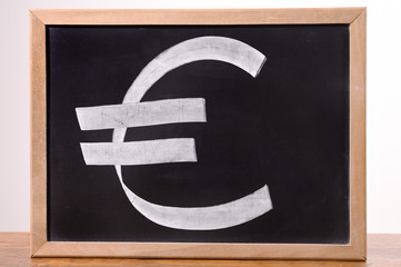 euro currency signs on the blackboard