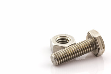 Metal screw and nuts on white background.
