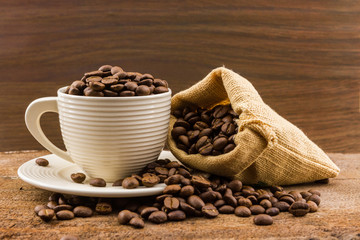 Brown roasted coffee beans in a canvas sack.