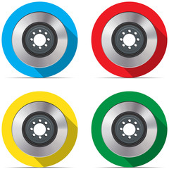 Set with brake discs on colored backgrounds with shadow
