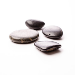 Fototapeta na wymiar Massage stones on white
