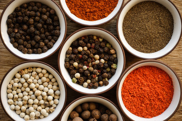 Various peppers in ceramic dishes located in the center