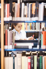 Young student searching for books