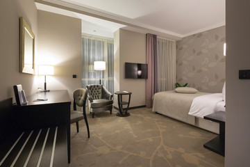 Modern bedroom interior in the evening