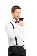 Fototapeta premium Elegant guy drinking red wine
