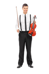 Young male violinist posing