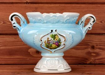 porcelain vase on a wooden background..