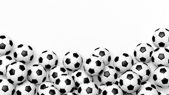 Pile of classic soccer balls isolated on white with copy-space