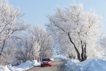 Car moving on beautiful winter road