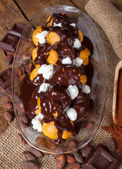 Chocolate profitteroles with cream