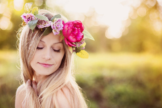 Beautiful woman with flower wreath.