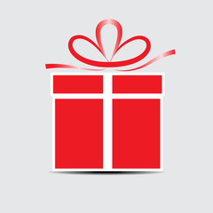 The red gift box on a gray background