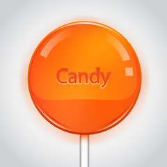 Orange candy on white background. Lollipop