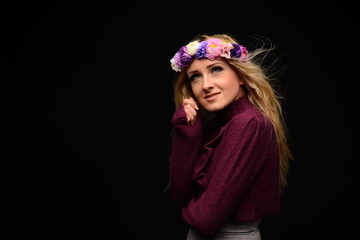 Young beauty woman portrait. Studio shot. Girl with Flower wreat