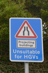 Projecting Buildings - narrow road sign