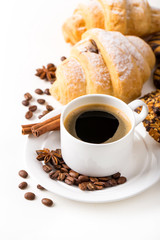 Breakfast with coffee and croissants on table