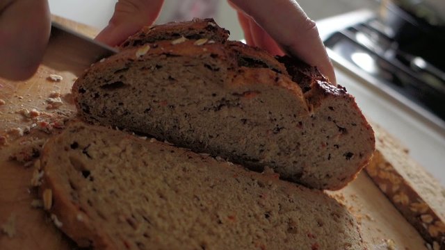Bread - man cut slice with knife