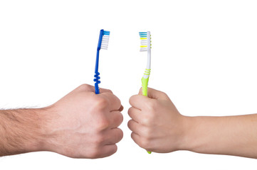 Toothbrush in hand isolated over white background