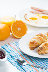 delicious breakfast with croissants and juice