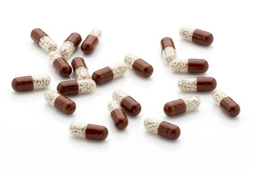 Antibiotic capsules on a white background.