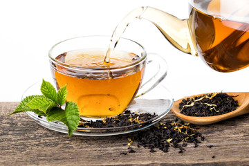Tea composition with mint leaf on wooden palette