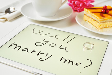 will you marry me? written in a tablet computer