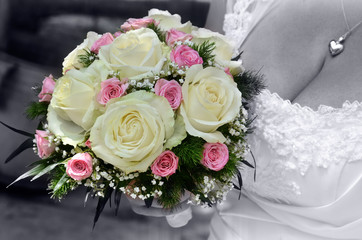 Bride wedding flowers bouquet with roses and green leaves