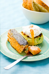 the fried salmon with a potato patty and poached egg